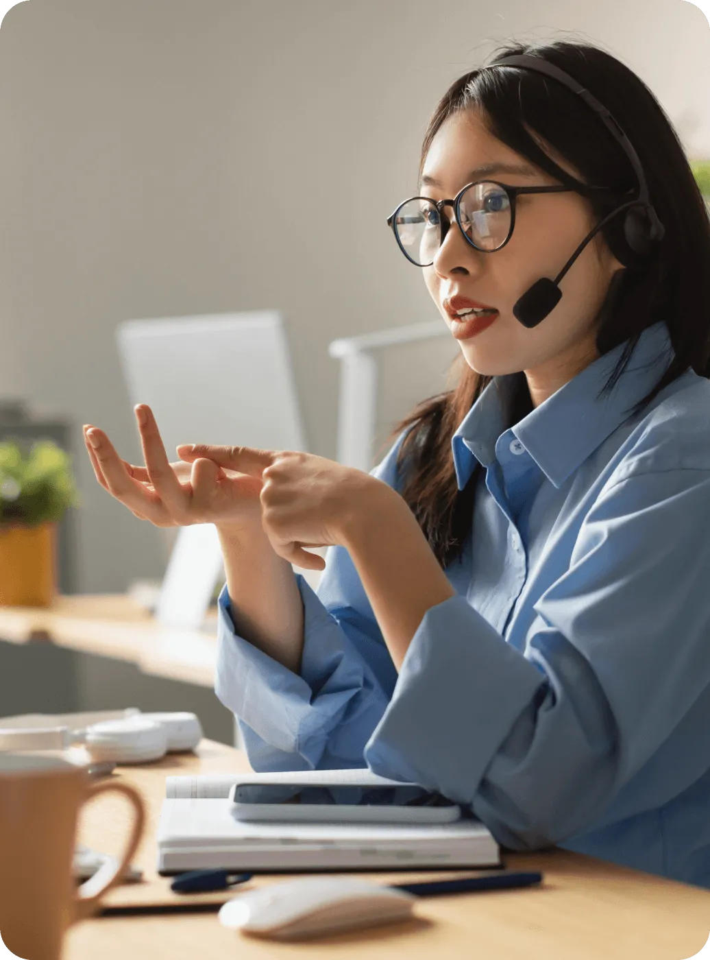 A female agent taking a phone call via her headset