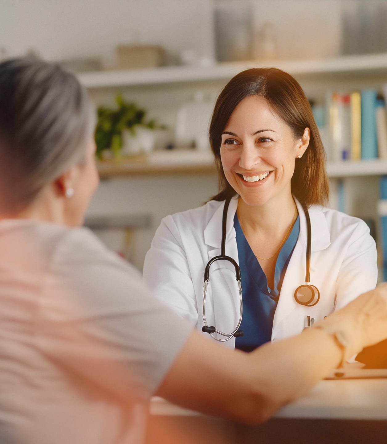 A doctor meeting with a patient for an in-person consultation