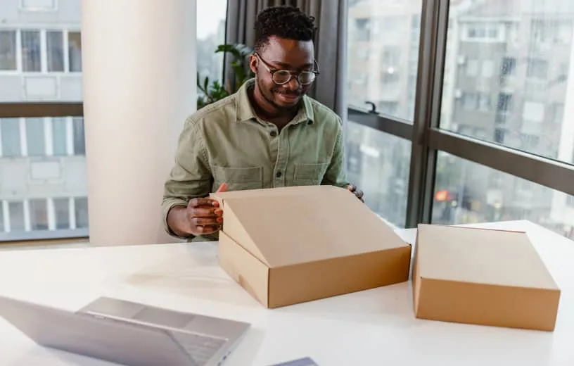A man opening a Device-as-a-Service subscription equipment from RingCentral