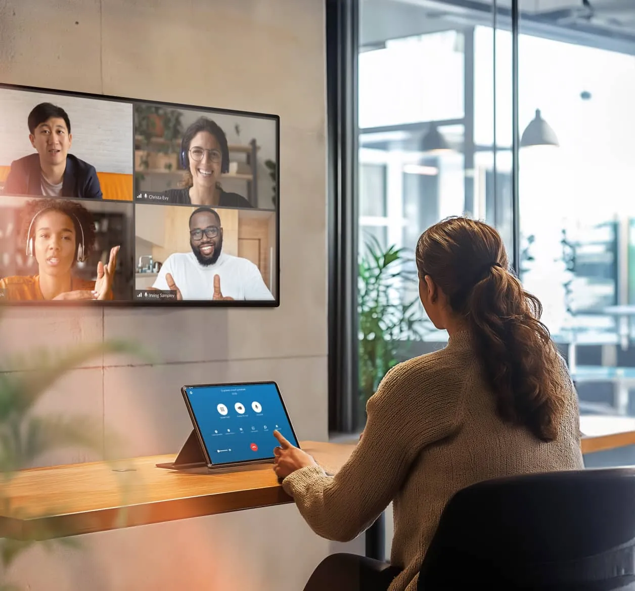 An in-office employee using RingCentral Rooms to host a hybrid meeting