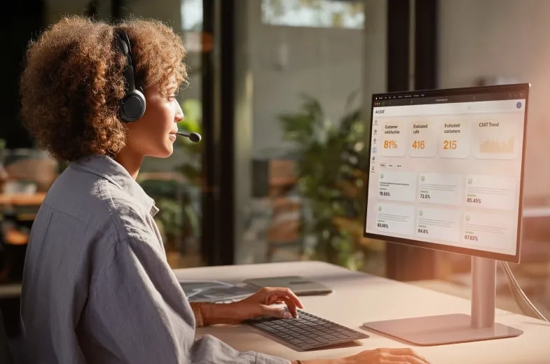 A female contact center agent looking at the RingCentral RingCX analytics dashboard