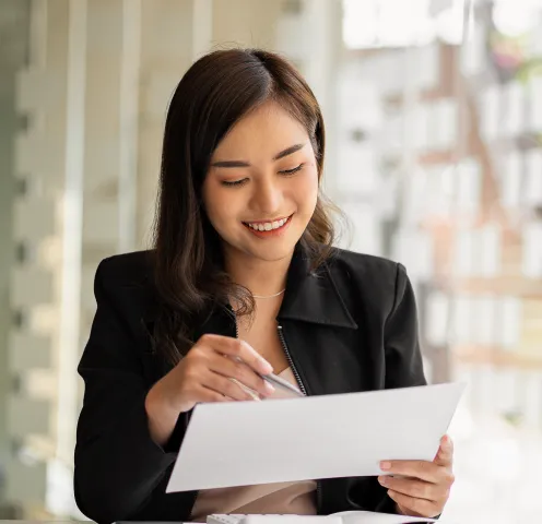 A woman reading the RingSense Service Privacy datasheet