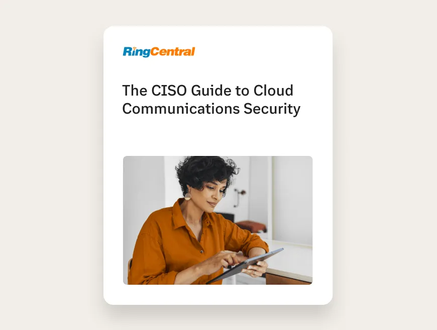 A woman reading the CISO Guide to Cloud Communications Security eBook on her laptop