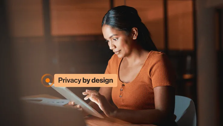A woman looking at the privacy features of the RingCentral app on a tablet.