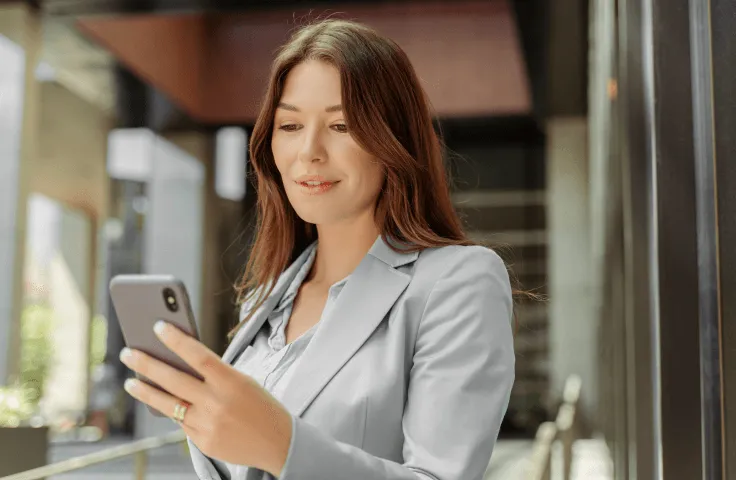 A woman looking at her mobile phone