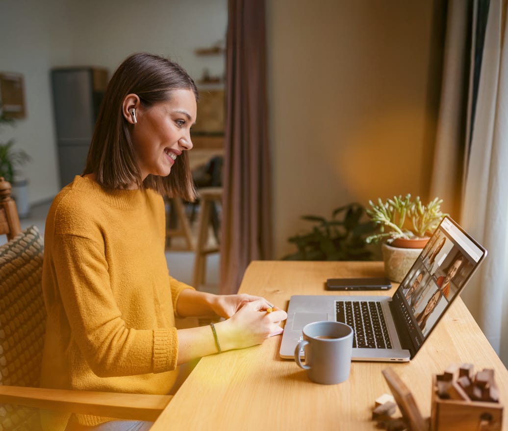 Female remote worker using RingCentral Video™ on her laptop