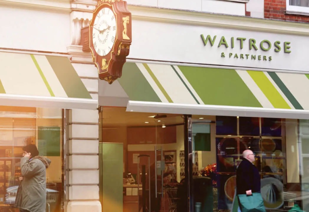 An outdoor shot of the Waitrose & Partners storefront